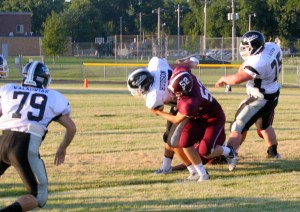 Jaden Peeden brings down a Knight ball carrier. Photo Credit/Steven Hosch.