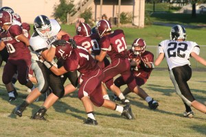 A wall of Cougar blockers (Simpson, Riecken, Bishop, and Hardeman) clear a path for Chevy Henneman. Photo Credit/Steven Hosch
