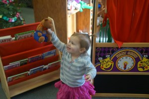 Emma Wallerstedt enjoys the books and other fun items at the Oakland Public Library. Photo Credit/Denise Gilliland/Editor and Chief, Kat Country Hub.