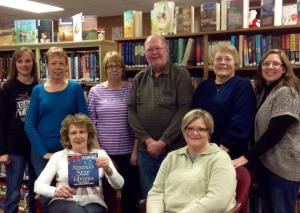 Proudly displaying the award are: JoAnne Peterson and Coleen Denton. (Back row l-r) Kristi Arlt, Audrey Unwin, Nancy Wonka, James Mashek, Vivian Forks, and Rosa Schmidt. Photo courtesy of Oakland Public Library.