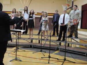 JH CHOIR:  front row, left to right: Cassidy Mentink, Janice Wuestewald, Amanda Alford, Layne Miller. back row from left to right:  Brandi Simonsen, Kassandra Prieto, Ryan Payton, Mathew Hartley, and Jarret Bobenmoyer. Directed by John Mayo. Photo Courtesy of LDNE.
