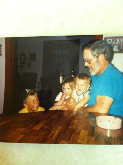 Grandpa Charlie (my dad) with his grandkids, from left, Justin, Amber and Derek. Photo courtesy of my sister, Angela Graham. 