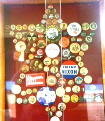 Kate Borchman's pin display, a collection of her dad's and grandpa's, is on display at Lyons Public Library. Photo Credit/Denise Gilliland, Editor and Chief, Kat Country Hub. 