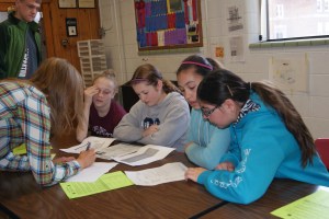 Michael Bracht gets on the Livestock Quality Assurance website as mom, Tricia keeps an eye on his progress.  Photo Credit/Mary Loftis.