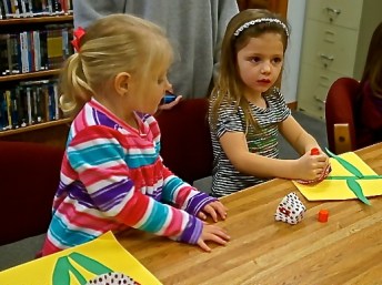 Ava Johnson and Hilary Ray made their flowers at the Oakland Library after story time. Photo Credit/Denise Gilliland, Editor and Chief, Kat Country Hub.