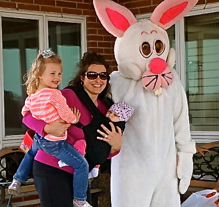 Brooke Peterson with her daughters, Paisley and Hadley pose with the Easter Bunny (Brock Denton) at Oakland Heights. Photo Credit/Denise Gilliland, Editor and Chief, Kat Country Hub.