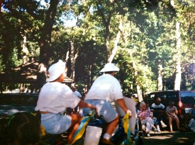 Jeannine Geraets and Denise Gilliland riding a bicycle built for two in the Burt County Fair Parade. Photo Courtesy of Denise Gilliland, Editor and Chief, Kat Country Hub.