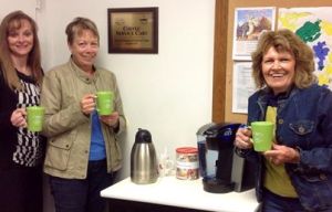 Enjoying a cup of coffee, with the new mugs, at the Oakland Library are Kristi Arlt, Audrey Unwin and Joanne Peterson. Photo Credit/Rosa Schmidt, Oakland Public Library Director. 