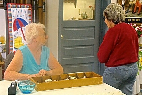 Hilda Benne, left, was in charge of the money and Jean Thomas was one of the helpers at the Golden Oaks fundraising sale. Photo Credit/Denise Gilliland, Editor and Chief, Kat Country Hub.
