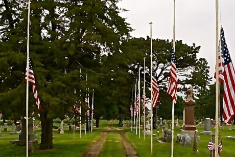 Flags at half mast during the Memorial Day Ceremony at the Lyons Cemetery honoring those that have fallen protecting this country and its freedoms. Photo Credit/Denise Gilliland, Editor and Chief, Kat Country Hub.