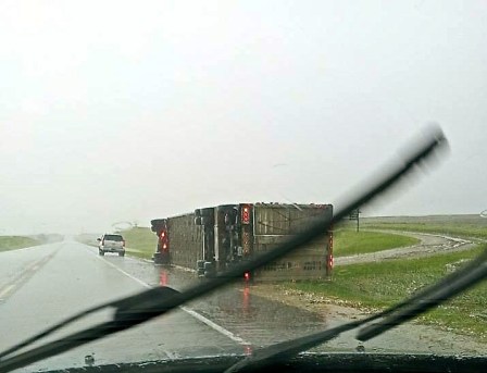 This semi was a victim of strong winds from the storm going through eastern Nebraska, just north of Uehling,  today. Photo Credit/Kristi Dahlgren. 