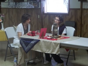 Amelia is sitting with the judge at the favorite foods contest a couple of years ago. Photo courtesy of Amelia Schlichting. 