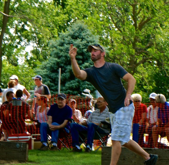 Tony Barada threw in the Horseshoe Tournament in Lyons on the 4th. He and his dad, Sam, took second place in the tournament. Photo Credit/Denise Gilliland, Editor and Chief, Kat Country Hub.