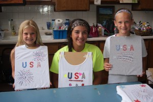 Patriotic and proud are these three 4-H members as they show off the patriotic t-shirts they created at the 4-H workshop last week. Pictured are: Lacey Petersen, Ashley Bohannon and Emma Wakehouse. Photo Courtesy of Mary Loftis.