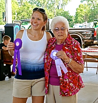 Megan (Ahrens) Willard, left, won first place at the pie contest for her strawberry pie. Second place went to her grandmother, Elfie Nelson for her peach pie. Photo Credit/Denise Gilliland, Editor and Chief, Kat Country Hub.