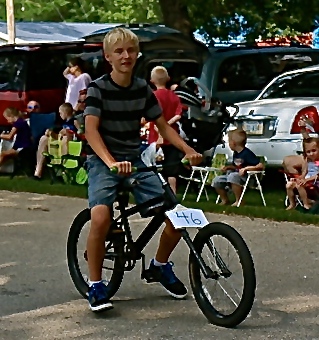 Whoever this is had a good idea for the fair parade...ride a bike through it! Photo Credit/Denise Gilliland, Editor and Chief, Kat Country Hub.