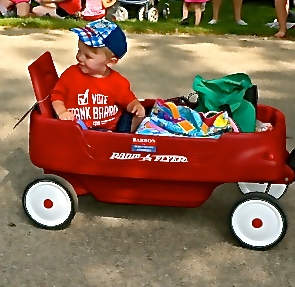 This little guy and his red wagon are hot on the campaign trail at the fair parade. Photo Credit/Denise Gilliland, Editor and Chief, Kat Country Hub.