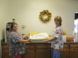 Sandy Francis on the right with her cake and on the left with Administrator David Deemer. Photos Courtesy of Oakland Heights.