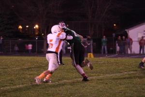 Cody Mallette takes on a Wisner-Pilger player on one of his six tackles for the night. Photo Credit/Cheri Droescher. 