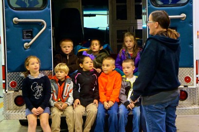 Lyons Fire and Rescue member Angela Whitley quizzes this group of kindergartners on what to do in case of a fire in the house. Photo Credit/Denise Gilliland, Editor and Chief, Kat Country Hub.