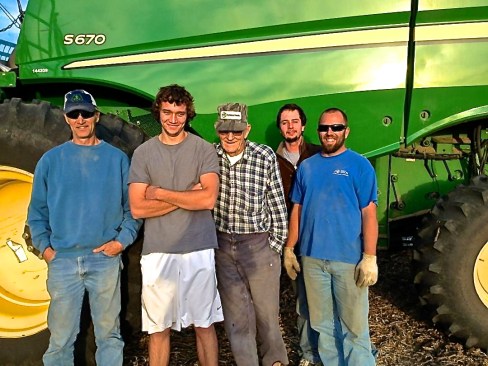 Justin Beck, right, works for the Nelson family of Wayne. They are all busy harvesting now, as are all farmers. From left is Don Nelson, Geoff Nelson, Marvin Nelson, whom is 91 years old and is still combining, and Taylor Nelson is behind Justin. Photo courtesy of Justin Beck.