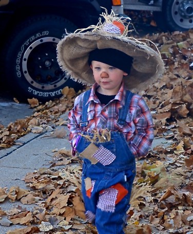 Trey Sluyter, son of Brooke Johnson and Tommy Sluyter has quite the scarecrow costume! He was one of many, many children trick or treating on Oakland's Main Street! Photo Credit/Denise Gilliland, Editor and Chief, Kat Country Hub. 