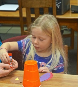 Laityn Johnson, brown hair, and Avery Christensen are busy making turkeys during crafty time at the Oakland Public Library. Both photos credit of Denise Gilliland, Editor and Chief, Kat Country Hub. 