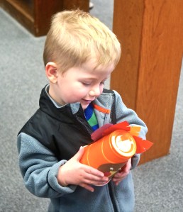 Blaise Hartwell with his finished turkey he made at the Oakland library during craft time. Photo Credit/Denise Gilliland, Editor and Chief, Kat Country Hub.