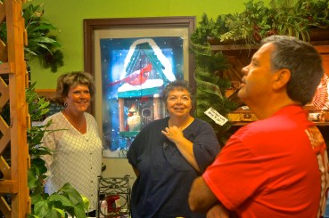 Sue, left, is visiting with Kamie and Tom Carmichael at Sue's open house, celebrating her 20 years of business. Photo Credit/Denise Gilliland, Editor and Chief, Kat Country Hub.