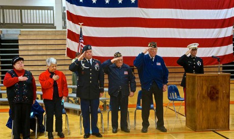 Saluting the American flag during the Veterans Day Ceremony were, from left, Mary Alice Pearson, Duane Hinman, Bill Hultquist, Bob Martin and Mike Blanc. Photo Credit/Denise Gilliland, Editor and Chief, Kat Country Hub. 