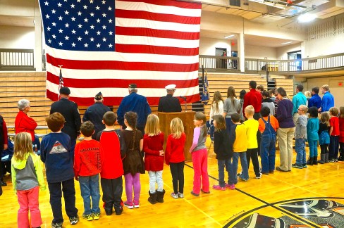 The Oakland-Craig first grade class led everyone in reciting the Pledge of Allegiance at the Veterans Day Ceremony. Photo Credit/Denise Gilliland, Editor and Chief, Kat Country Hub. 