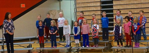 The OC Kindergarten class along with teacher Tawnya Meyer sing God Bless America at the Veterans Day Ceremony. Photo Credit/Denise Gilliland, Editor and Chief, Kat Country Hub. 