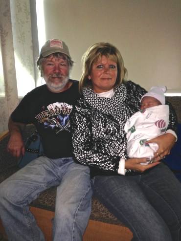 Nana, papa and granddaughter Charli. 