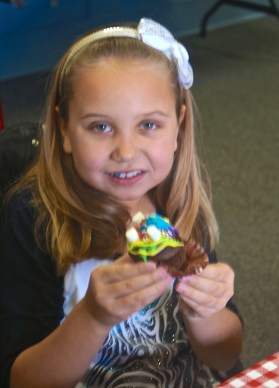 Taryn Harney is proud of the cupcake she decorated at the firehall. Photo Credit/Denise Gilliland, Editor and Chief, Kat Country Hub. 