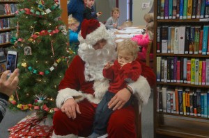 Santa had many children to sit on his knee at the Oakland Library today. They were all happy to see him! All photos credit of Denise Gilliland, Editor and Chief, Kat Country Hub.