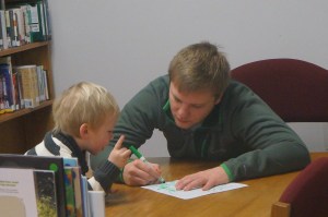 Uncle Preston shows his nephew Trey how to draw, then Trey decides to try it himself! Photos Credit of Denise Gilliland, Editor and Chief, Kat Country Hub.