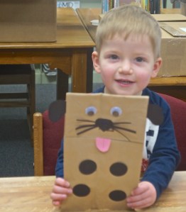 Blaise Hartwell proudly displays the puppy he made during craft time at the Oakland library. Photo Credit/Denise Gilliland, Editor and Chief, Kat Country Hub.