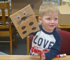 Blaise Hartwell shows what his puppy does at the Oakland Public Library. Photo Credit/Denise Gilliland, Editor and Chief, Kat Country Hub.