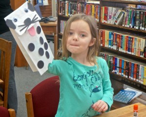 Laityn Johnson has a cute puppy to show off at the Oakland Library. Photo Credit/Denise Gilliland, Editor and Chief, Kat Country Hub.