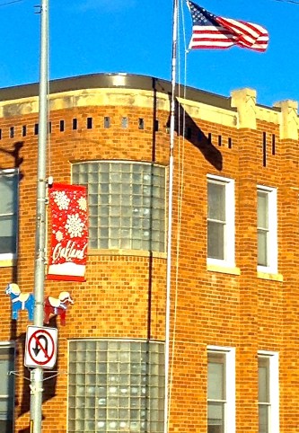 The flag pole in front of the Oakland City Auditorium has been repaired and a new flag is now flying, thanks to the assistance of the Oakland city employees. Photo Credit/Denise Gilliland, Editor and Chief, Kat Country Hub. 