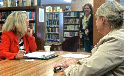 Representative for U.S. Senator Deb Fischer, Tiffany Settles, from left, Rosa Schmidt, library director and Executive Director for Burt County Economic Development Corporation Patty Plugge visit about local and regional issues at the Oakland Library recently. Photo Credit/Denise Gilliland, Editor and Chief, Kat Country Hub. 
