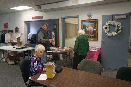 Elfie Nelson is visiting with Lee Schinck at the Golden Oaks Rummage sale while Betty Rogers is looking over some items. Photo Credit/Denise Gilliland, Editor and Chief, Kat Country Hub.