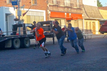 One of the teams participating in the first ever Swedish Festival tractor pull had the following members, from left: Zach Ahrens, Kris Krutilek, Dillon Johnson and Mike Lass. Photo Credit/Denise Gilliland, Editor and Chief, Kat Country Hub. 