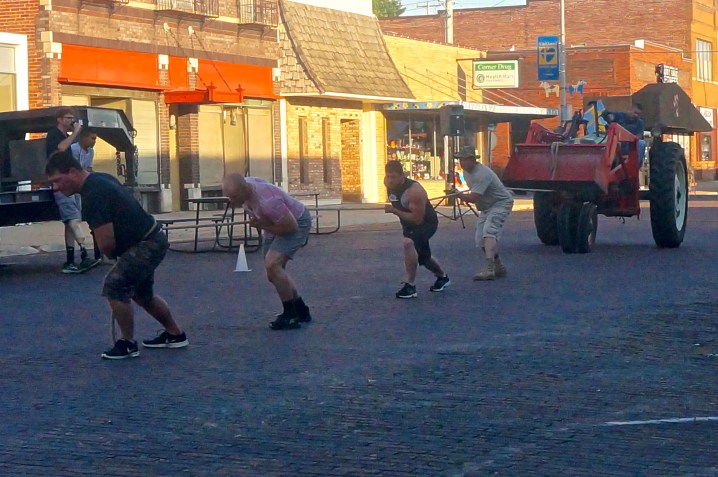 Several teams competed at the first tractor pull to be held at the Swedish Festival. This team includes, from left, Greg Mockenhaupt, Heath Swanson, Loren Peterson and Duane Hinman. Photo Credit/Denise Gilliland, Editor and Chief, Kat Country Hub. 