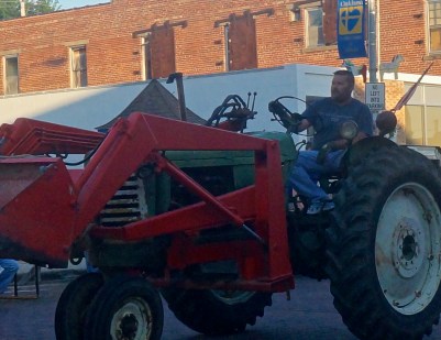 Chad Linder had tractor duties at the Swedish Festival tractor pull. Photo Credit/Denise Gilliland, Editor and Chief, Kat Country Hub. 