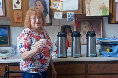 Mary Ellen Raines, Independent Distributor of Organo Gold Coffee, was at Creative Connections during the Swedish Festival, serving samples of the coffee to festival goers. Photo Credit/Denise Gilliland, Editor and Chief, Kat Country Hub.