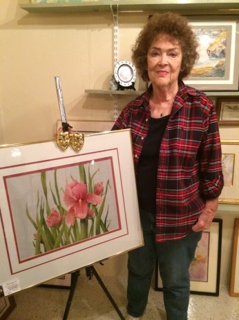 Dona Jean Nelson, pictured with one of her many paintings, is the June Artist of the Month. Photo courtesy of Julie Johnson. 