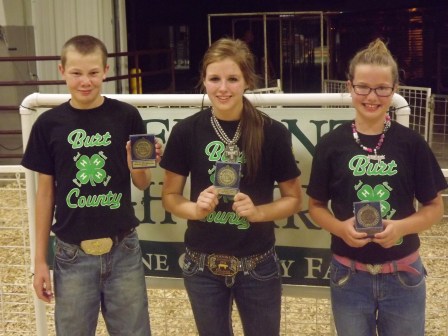 Burt County showmanship skills were apparent at the Fremont 4-H Fair Swine Showmanship Contest Saturday evening in Fremont. Brayden Anderson of Lyons won the Intermediate Division while Jenna Bromm of Oakland won the Senior Division and Elise Anderson of Lyons placed third in the Junior Division. Photo Credit/Kevin Anderson. 