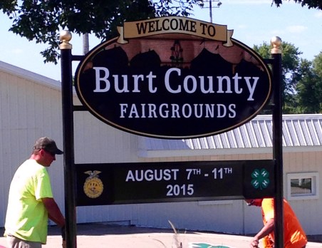 Employees from CBS Signs Inc., where former Oaklander  Don Denton is the General Manager, installed the new Burt County Fair sign this morning. Photo Credit/Denise Gilliland, Editor and Chief, Kat Country Hub. 