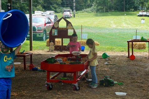 These youngsters are enjoying playing with all of the toys in the Kid Zone at the Burt County Fair. Both photos credit of Denise Gilliland/Editor and Chief, Kat Country Hub. 